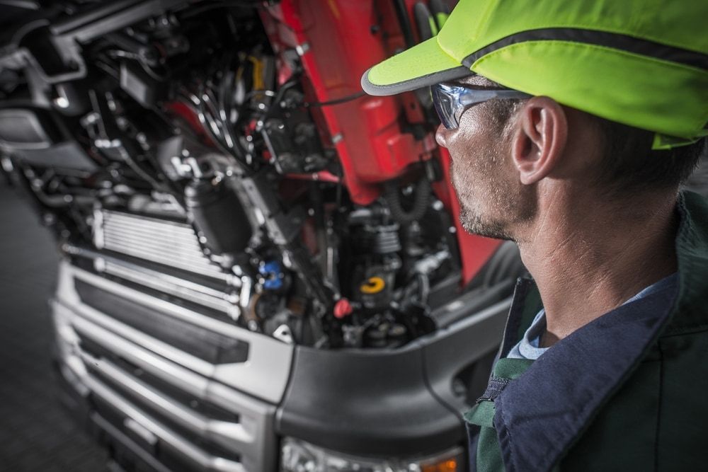 Mechanic Inspecting Truck Engine — Direct Current Solutions in Mareeba, QLD