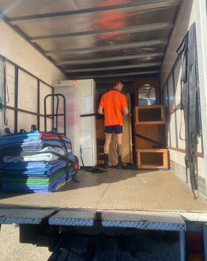 Removalists Townsville Furniture Loading Into Moving Truck — Uplift Removals in Burdell, QLD