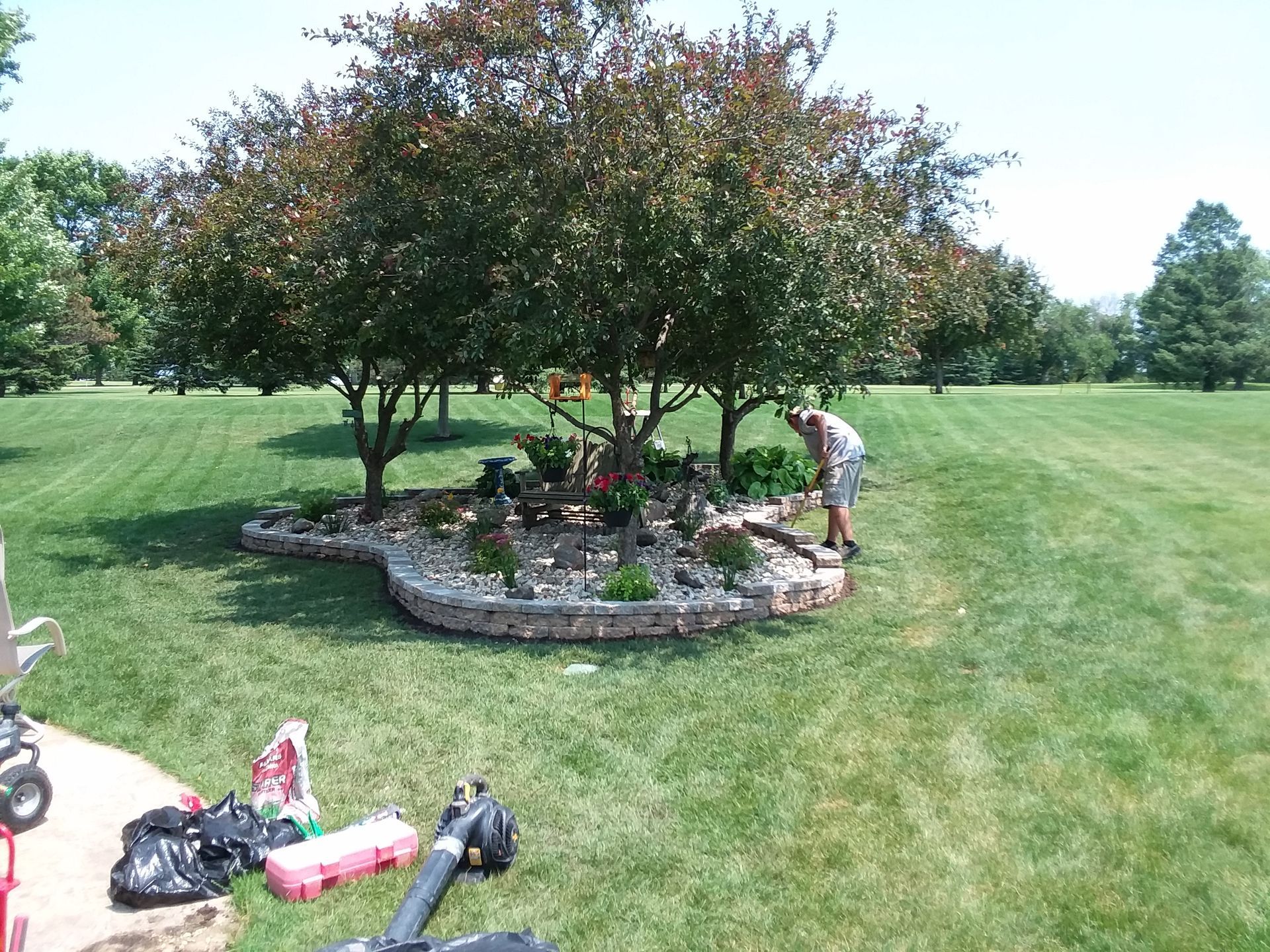 custom flower bed around iowa trees