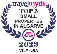 TravelMyth award: Top 5 Small Properties in Algarve, 2023. Features a laurel wreath, building icon, and