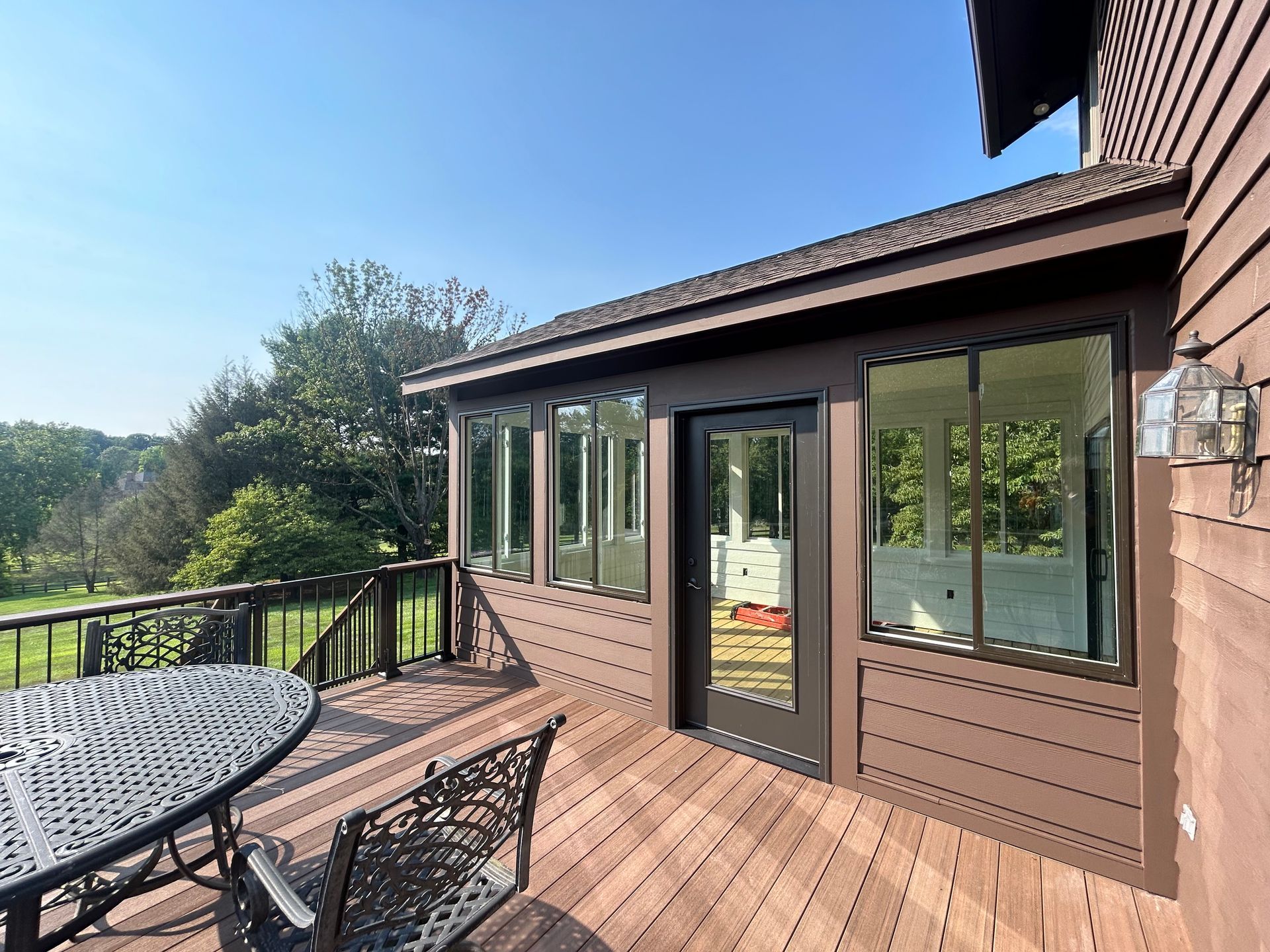 Composite wood deck custom-built by DreamAway Exteriors.