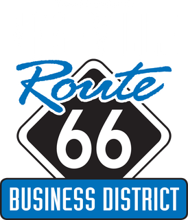 A Route 66 highway sign with a blue