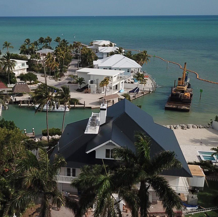 Islamorada Florida Keys Black Interlock Slate Metal Roofing System installed on colonial home on the Gulf of Mexico