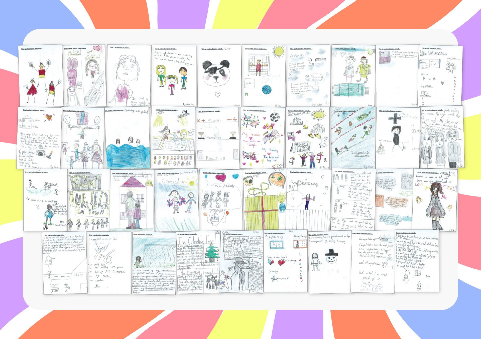 Arrangement of hand-drawn cards, likely children's art, on a white board with a colorful background.