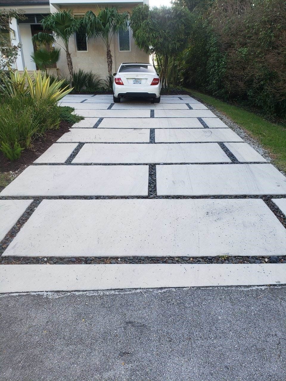 White Car on Driveway — Miami, FL — Concrete Services Pump and Finishing Inc.