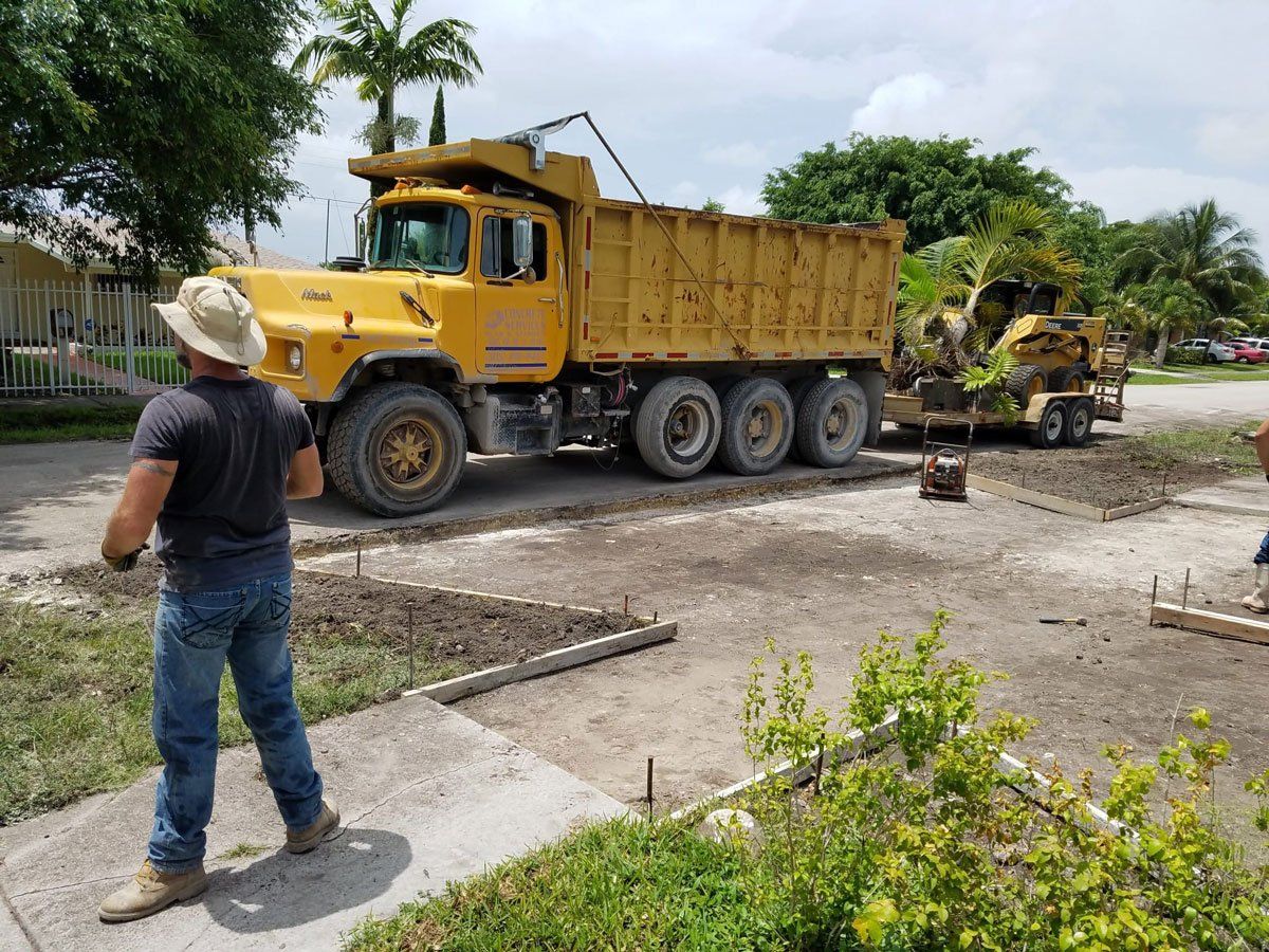 Yellow Truck — Miami, FL — Concrete Services Pump and Finishing Inc.