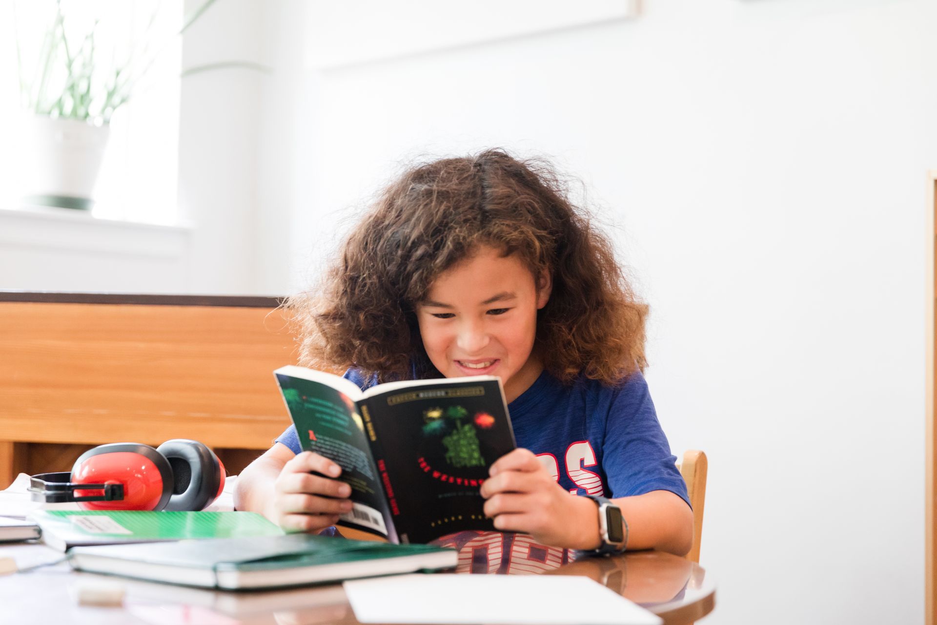 montessori elementary child reading a book