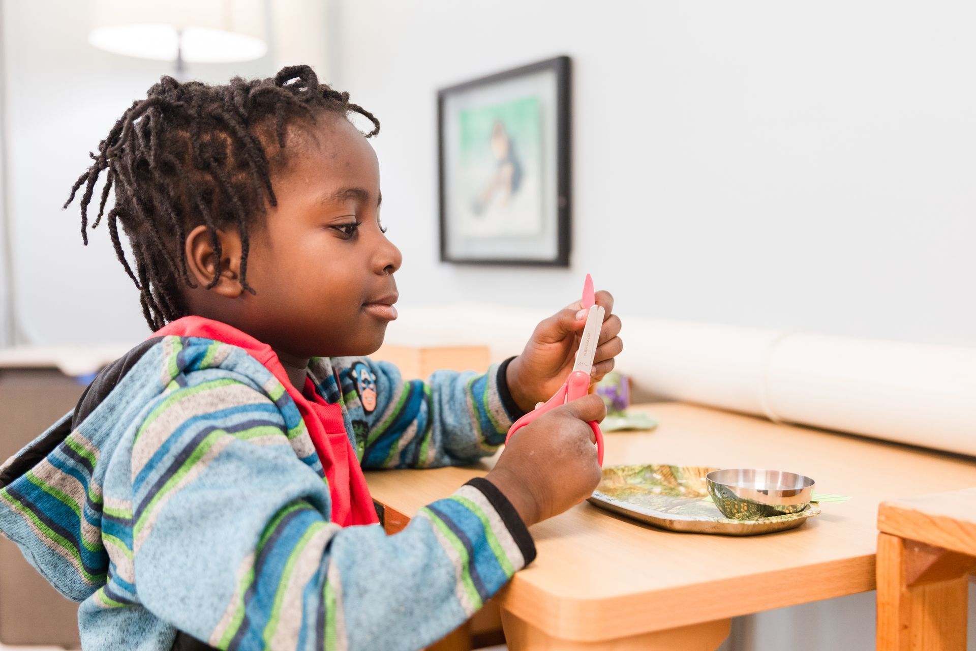 montessori child working with craft activity