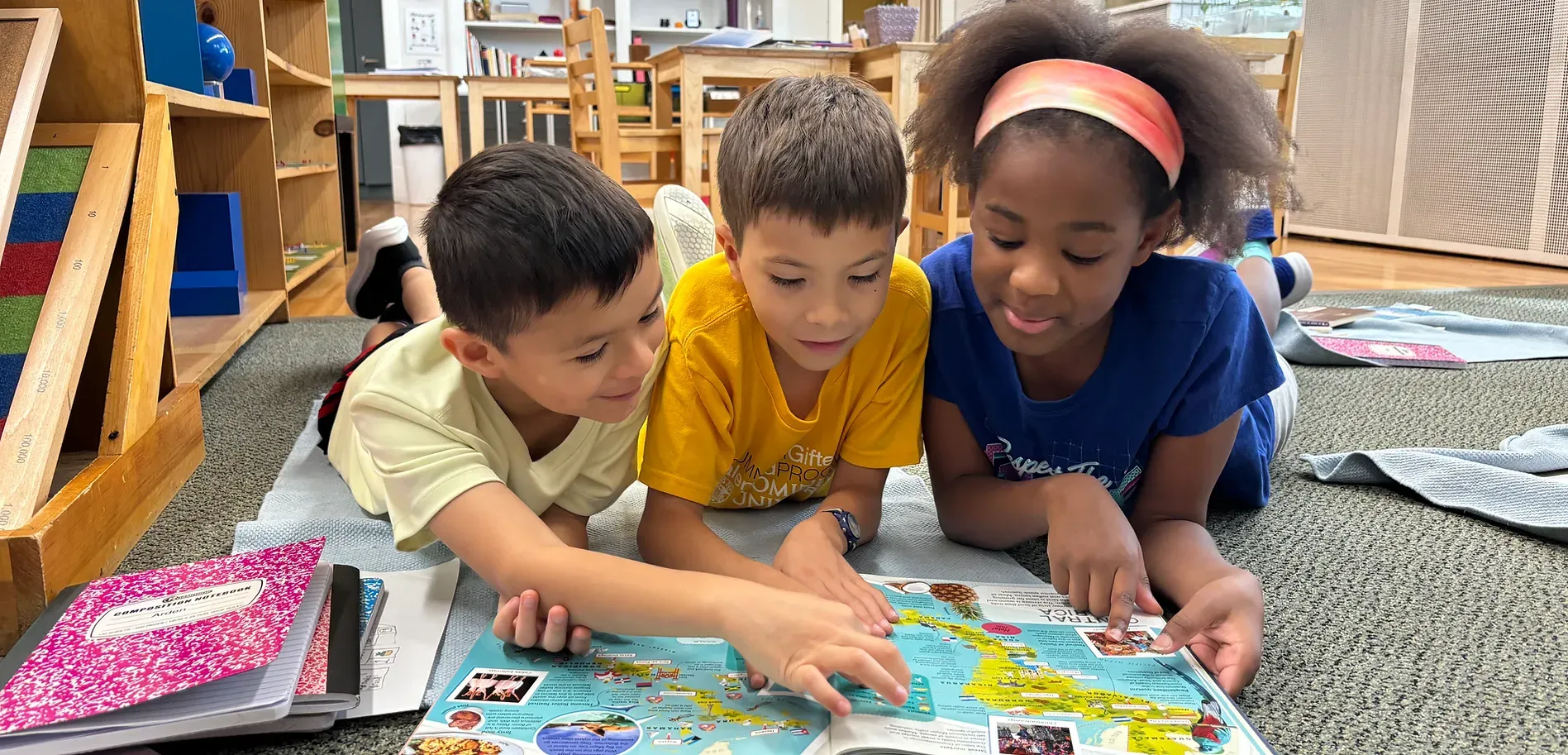 montessori children reading a book
