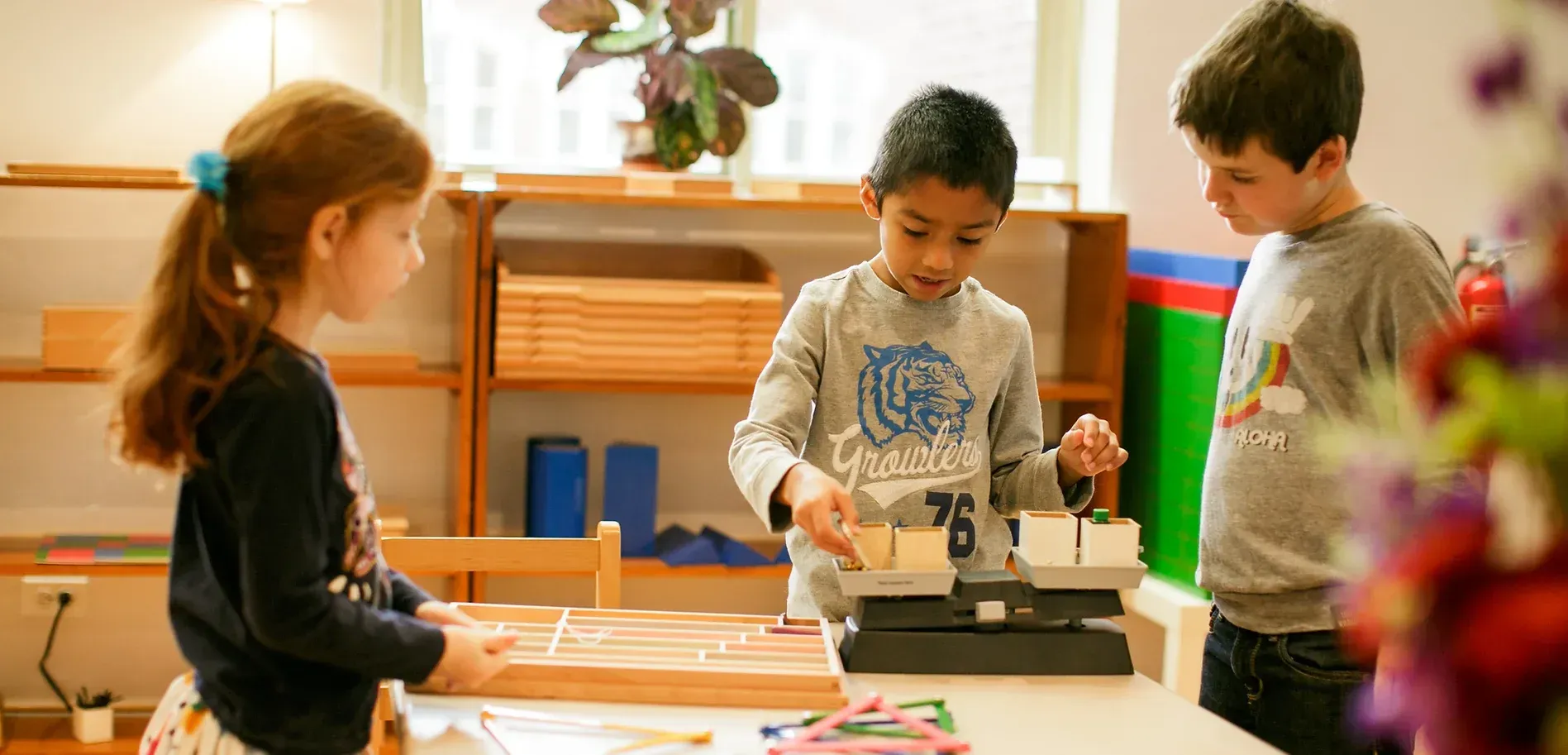 Montessori children working with math activity