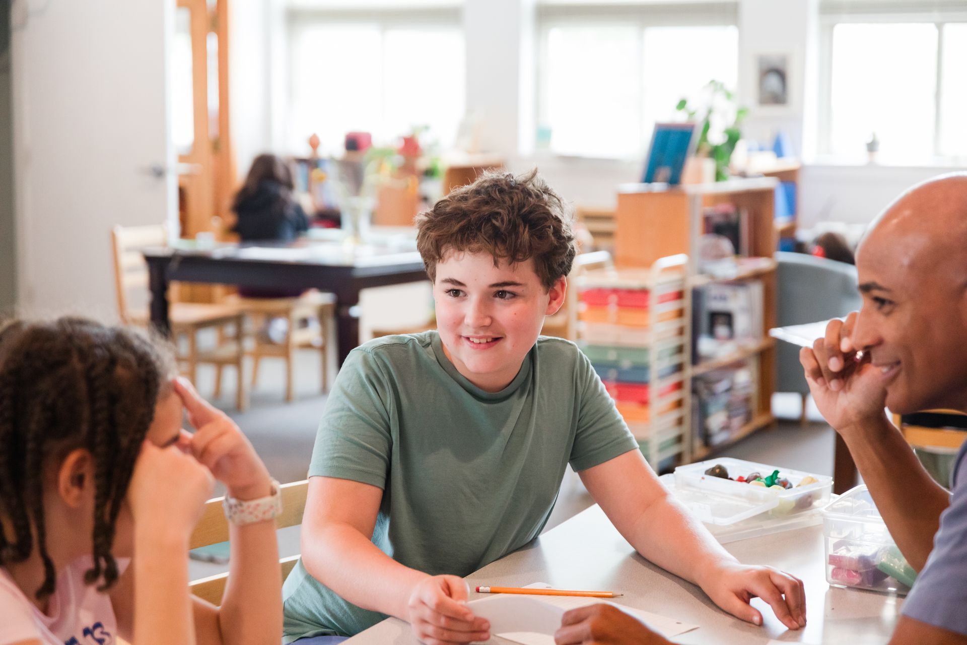 Montessori guide and children in the classroom