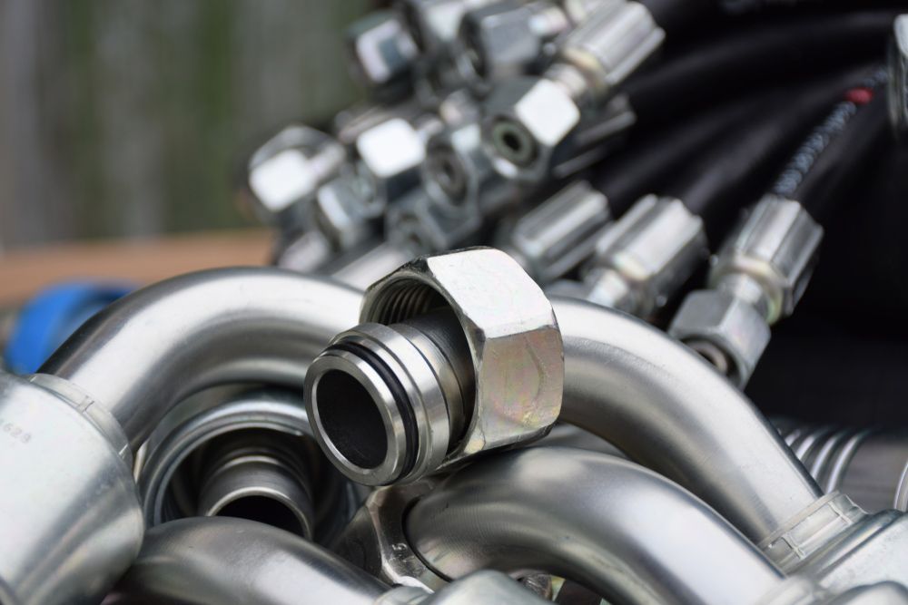 A Bunch Of Hydraulic Hoses Are Stacked On Top Of Each Other — Alice Hosetech & Industrial Supplies in Ciccone, NT