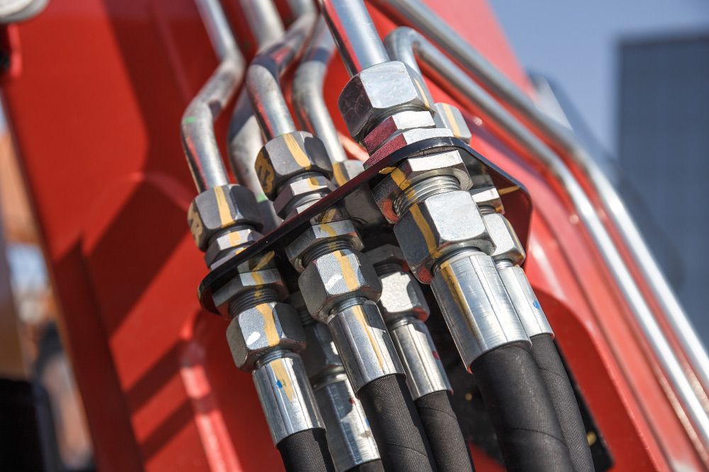 A Close up Of Hydraulic Hoses on A Machine — Alice Hosetech & Industrial Supplies in Ciccone, NT
