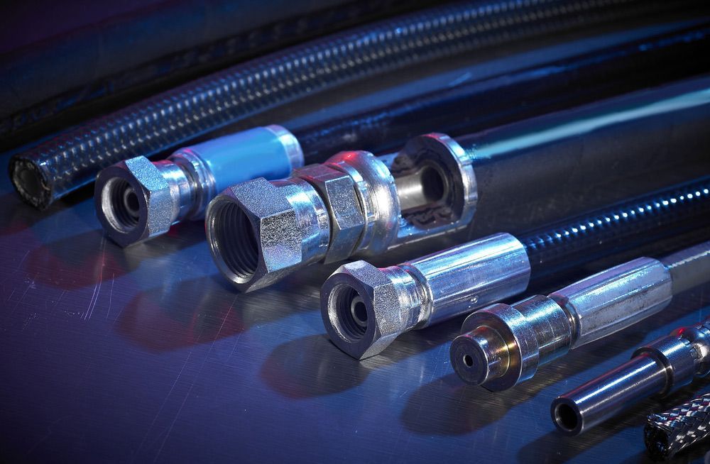 A Bunch Of Hydraulic Hoses Next To Each Other — Alice Hosetech & Industrial Supplies in Ciccone, NT