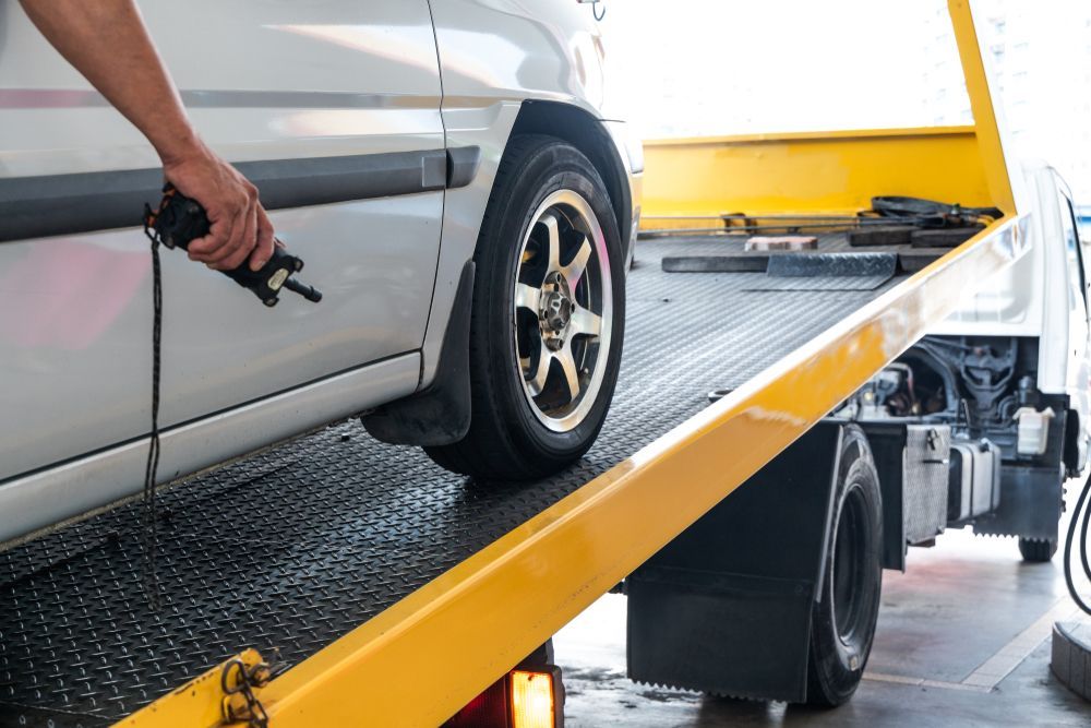 A Van Is Being Towed By A Tow Truck — Alice Hosetech & Industrial Supplies in Ciccone, NT