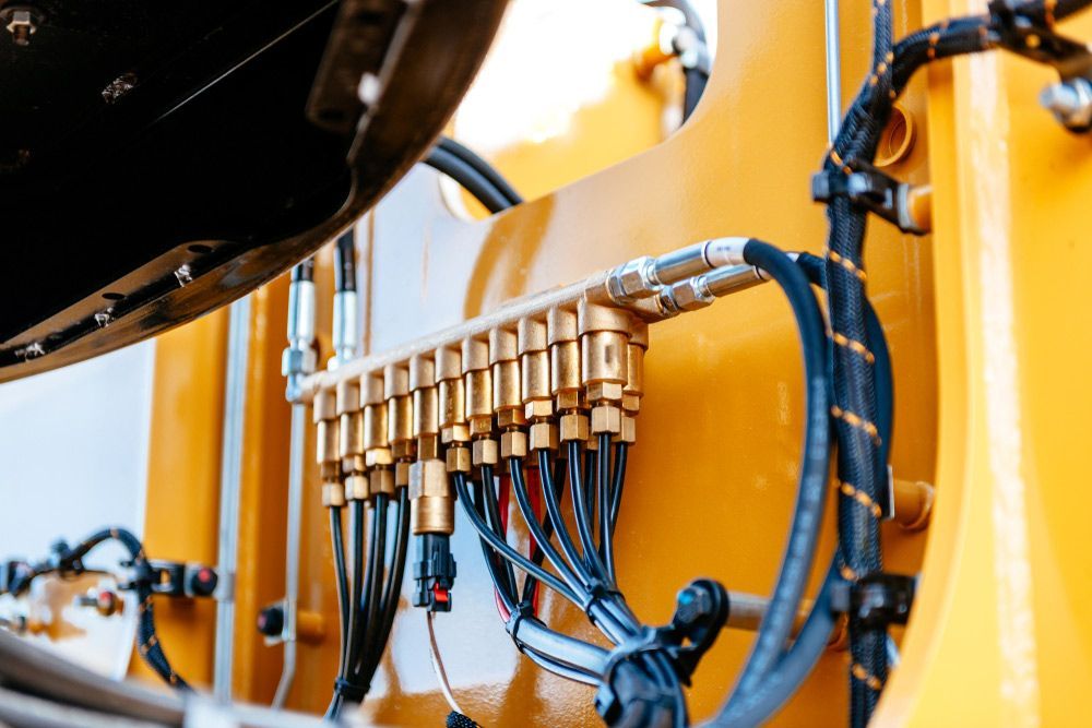 A Close up Of a Yellow Machine with A Bunch of Wires Coming out Of It — Alice Hosetech & Industrial Supplies in Ciccone, NT