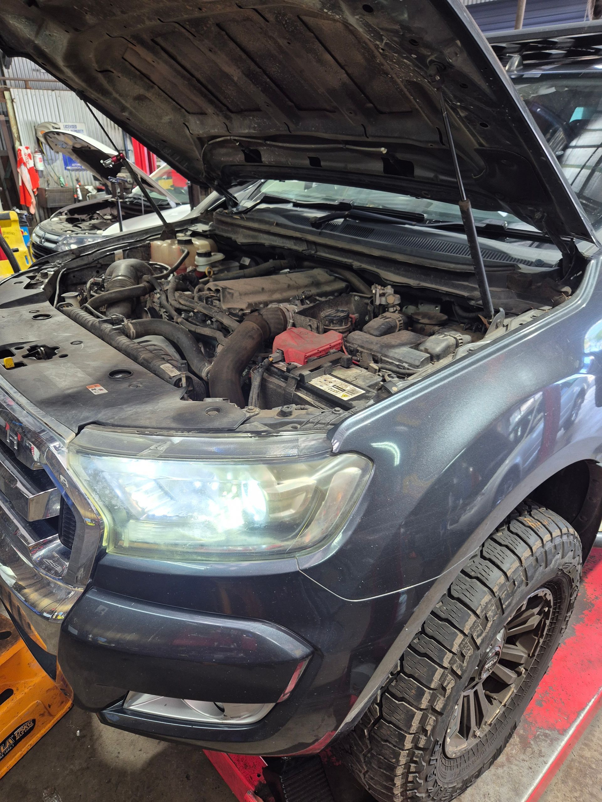 A close up of a car getting mechanical work done in Maitland