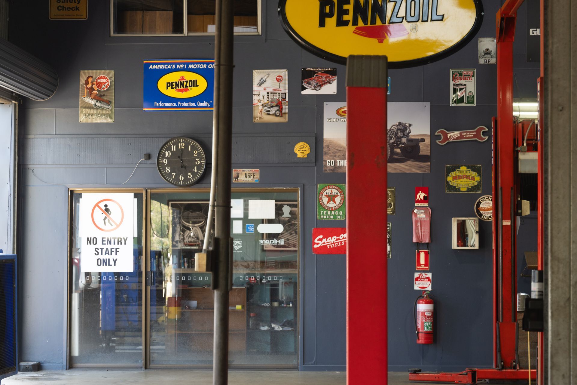 A Person Is Working on A Motorcycle in A Garage — Cherry's Automotive Repairs In Maitland, NSW