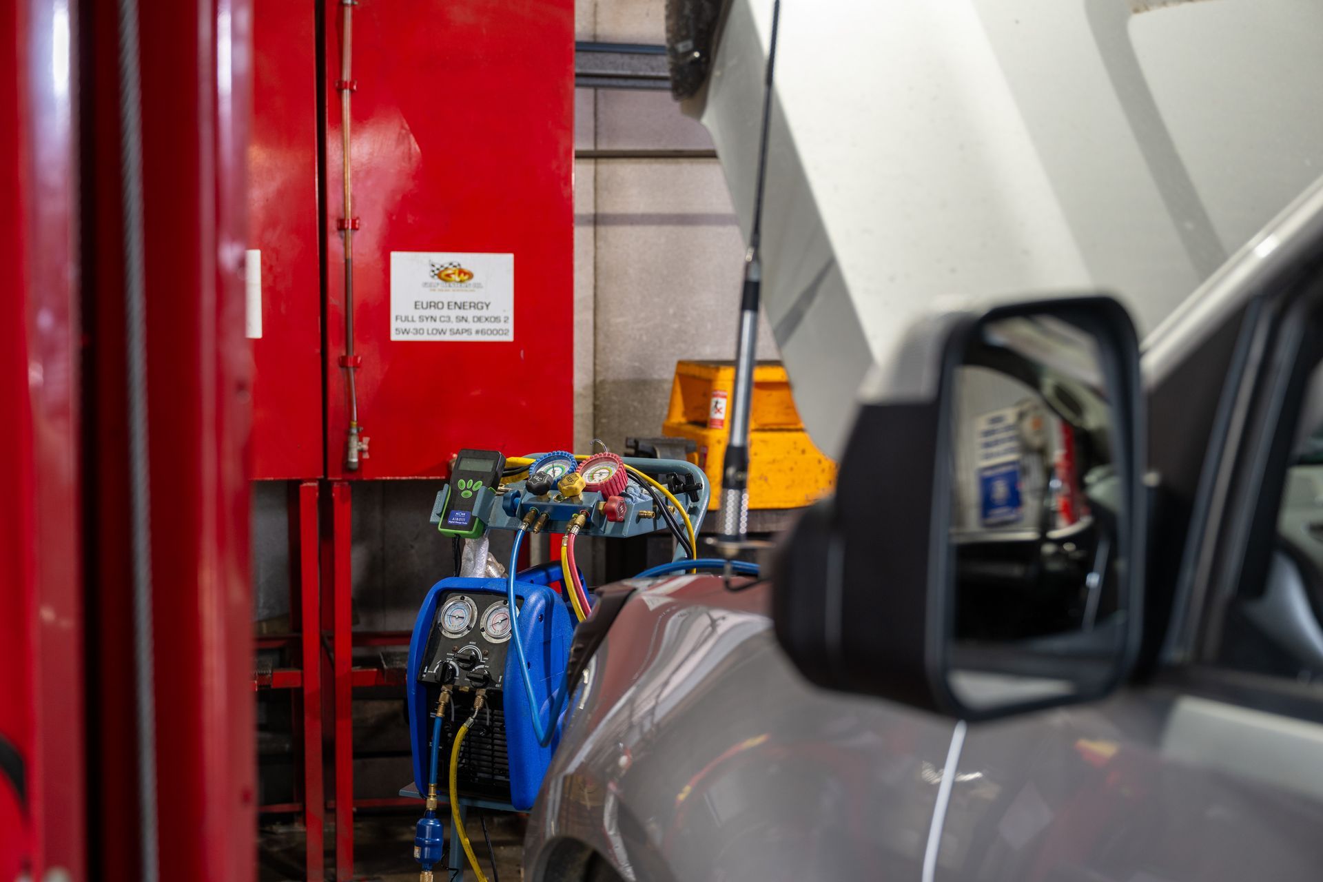 Side view of a car having mechanical repairs