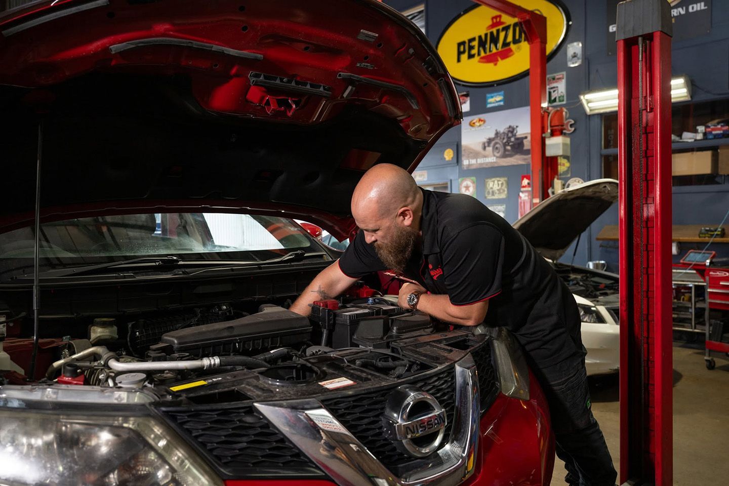 Mechanic Performing A Full Car Service In Maitland