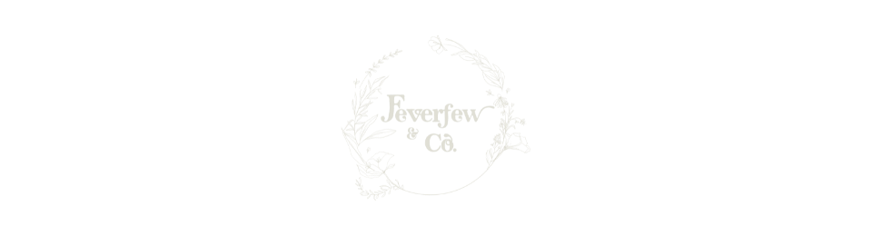 Faint circular logo with cursive text and a small central emblem on a white background