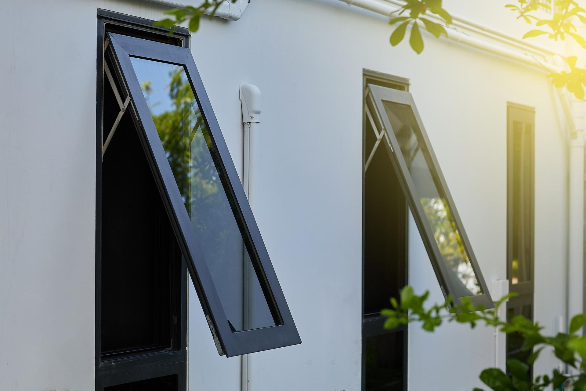 Two Windows Are Open on a White Building With the Sun Shining Through Them — Glass & Window Centre, Dubbo, NSW