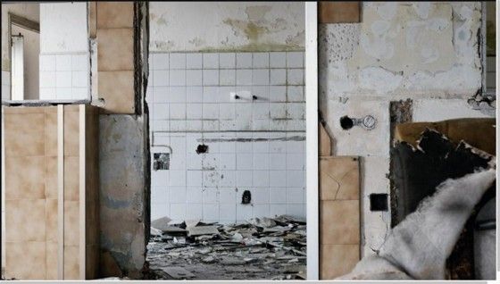 Water damaged wall and tile before restoration - Utah Flood Guys Salt Lake City