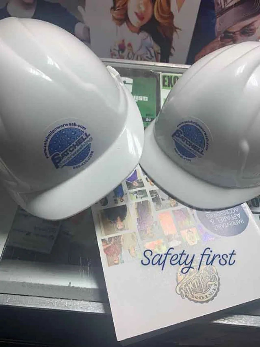 Two hard hats are sitting on top of a safety first book
