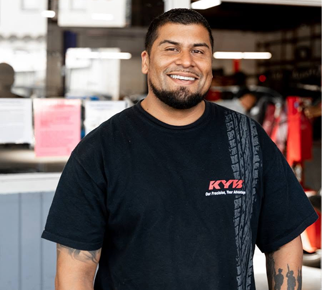 Technician in our garage, ready to perform expert auto repair in San Bruno, CA | Hanlon's Tire Service