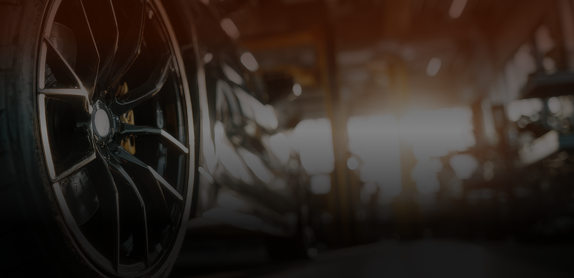 Up close to tires of vehicle in garage | Hanlon's Tire Service