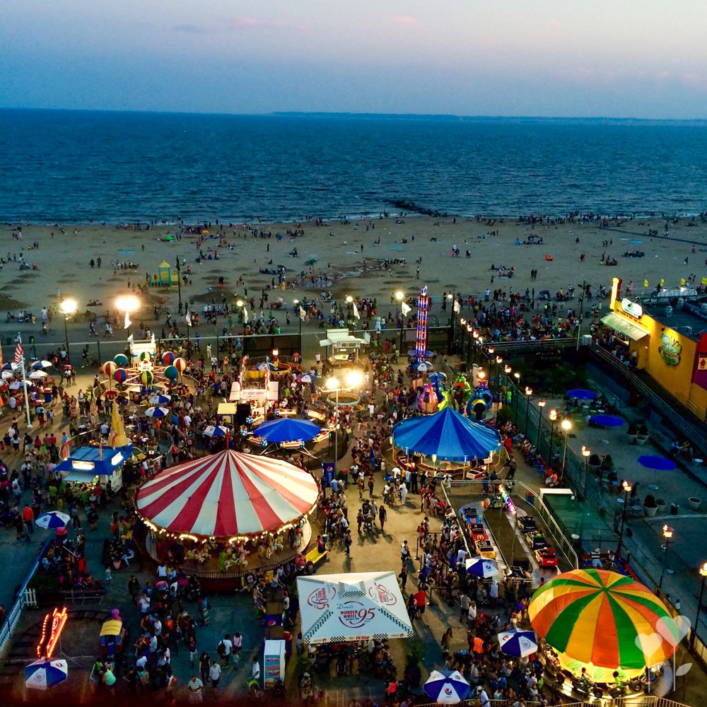 an aerial view of a carnival with a sign that says ' coca cola ' on it