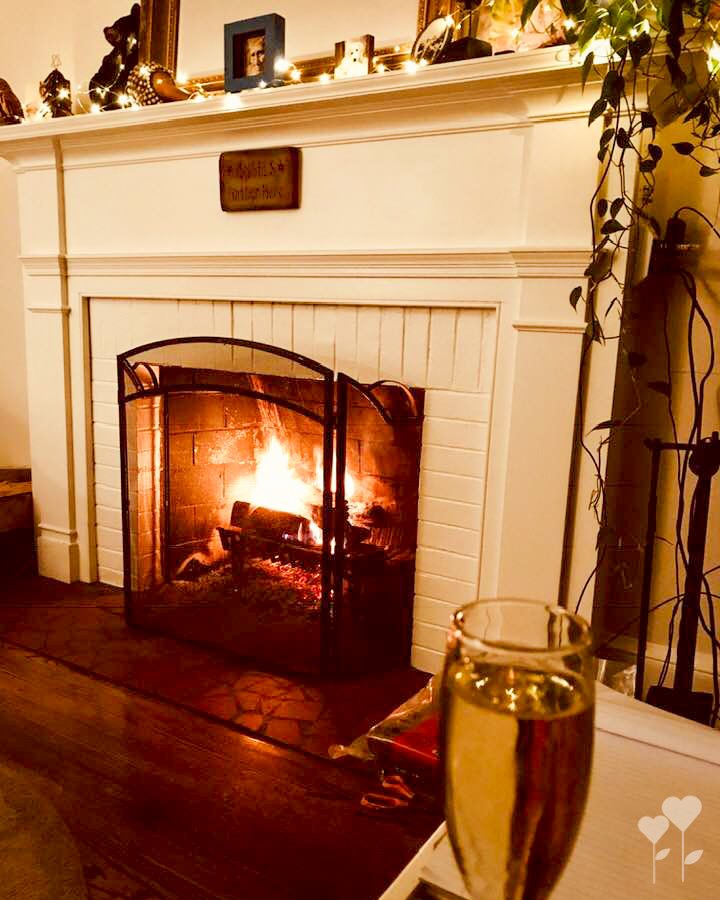 a fireplace with a sign on it that says 