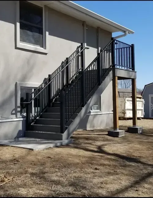 A vertical picket custom metal railing with ADA handrails on staircase built and fabricated by 83MetalCraft, LLC in Boise, Idaho