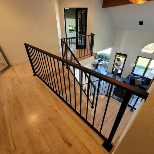 Black vertical custom railings for stairs by 83MetalCraft LLC