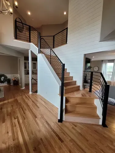 Interior horizontal metal railing fabricated and installed by 83MetalCraft, LLC in Meridian Idaho