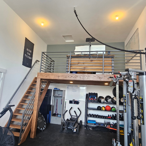 A custom horizontal metal railing for a mezzanine fabricated and installed by 83MetalCraft, LLC in Meridan Idaho