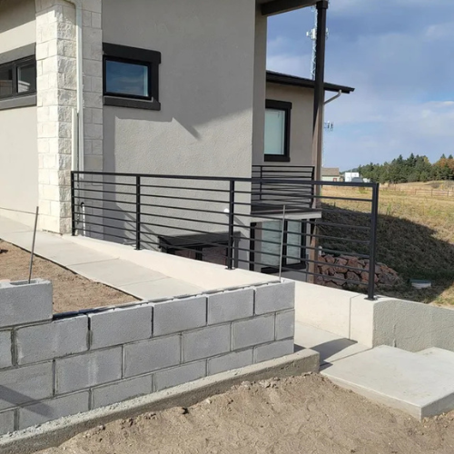 Black outdoor horizontal metal railing fabricated by 83MetalCraft LLC in Boise Idaho