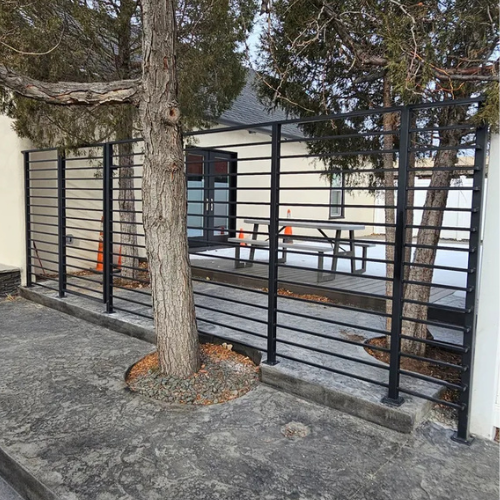 Custom black horizontal metal fence and gate for a business in Eagle Idaho fabricated by 83Metalcraft, LLC in Boise Idhao