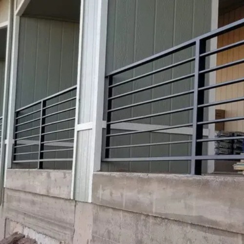 A black custom horizontal metal railing fabricated and installed by 83MetalCraft, LLC in Boise Idaho