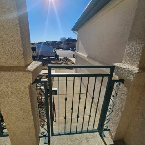 an ornamental Iron gate fabricated and installed By 83MetalCraft, LLC for a residence in Kuna Idaho