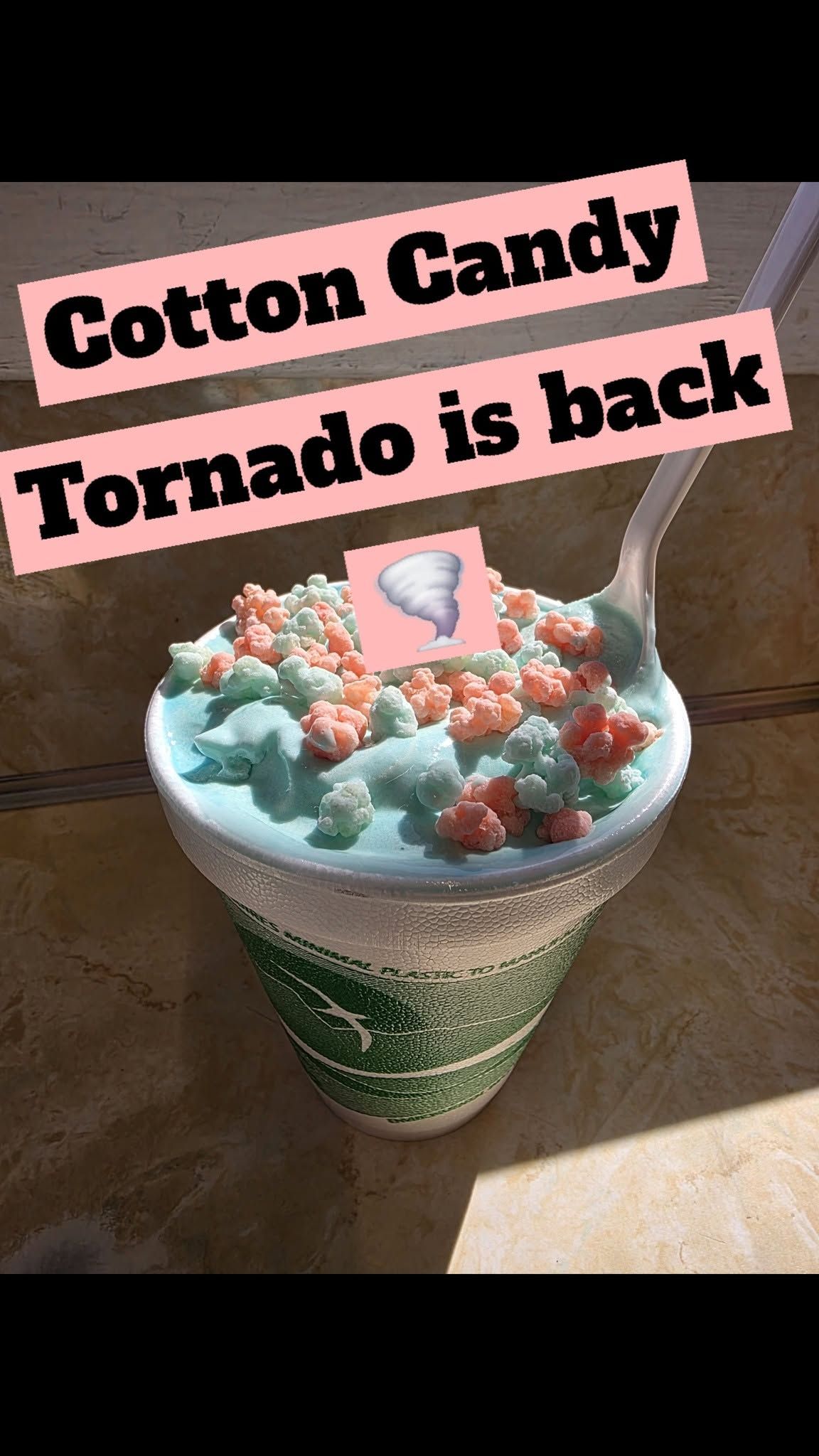 Cotton candy-topped snow cone in a green cup with text: “Cotton Candy Tornado is back”