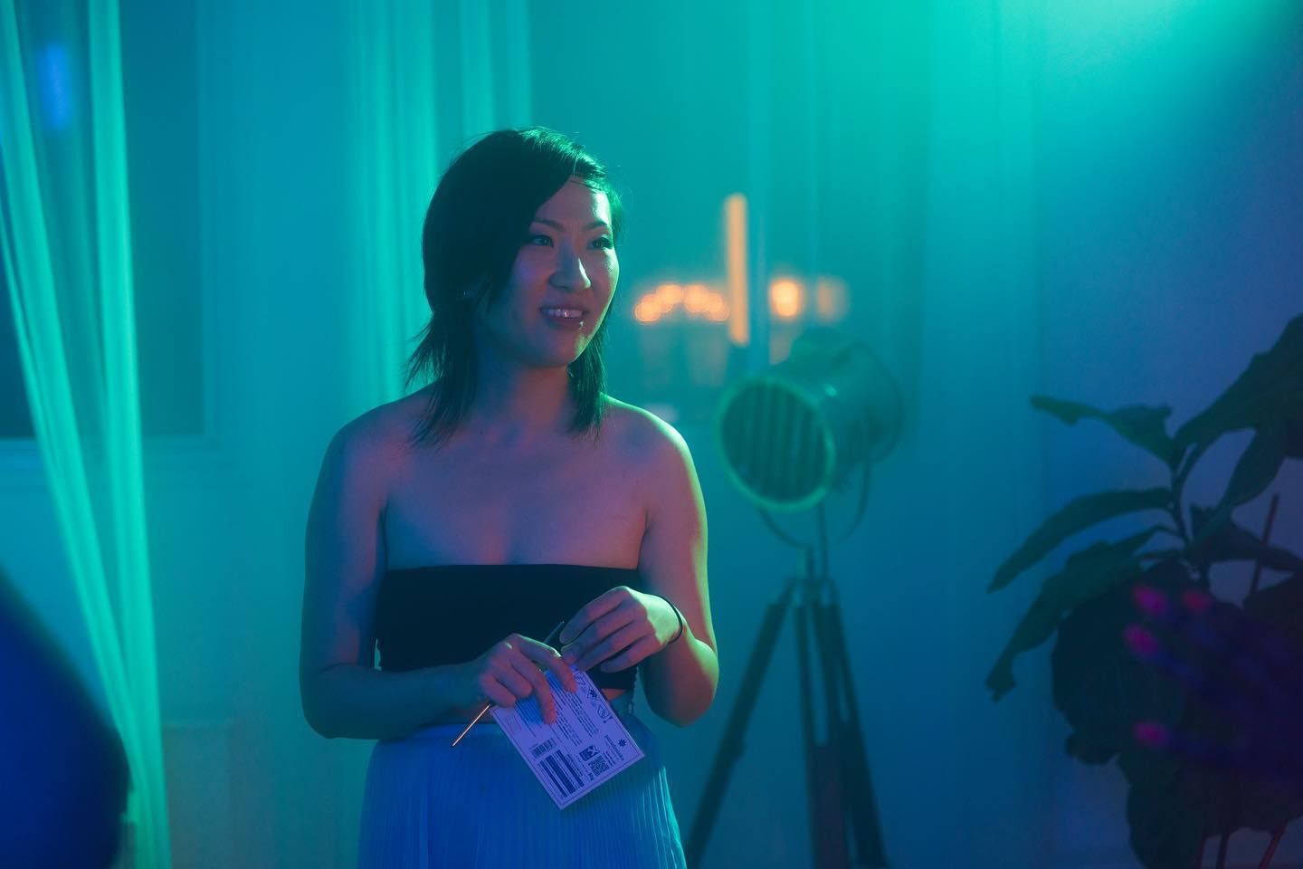 Woman standing in blue lit room