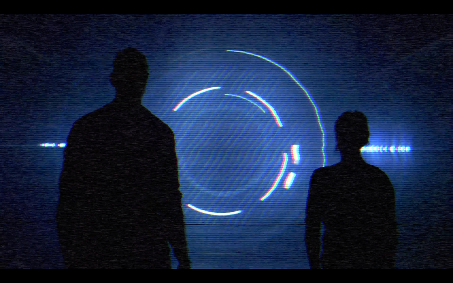 Two silhouettes in front of blue screen