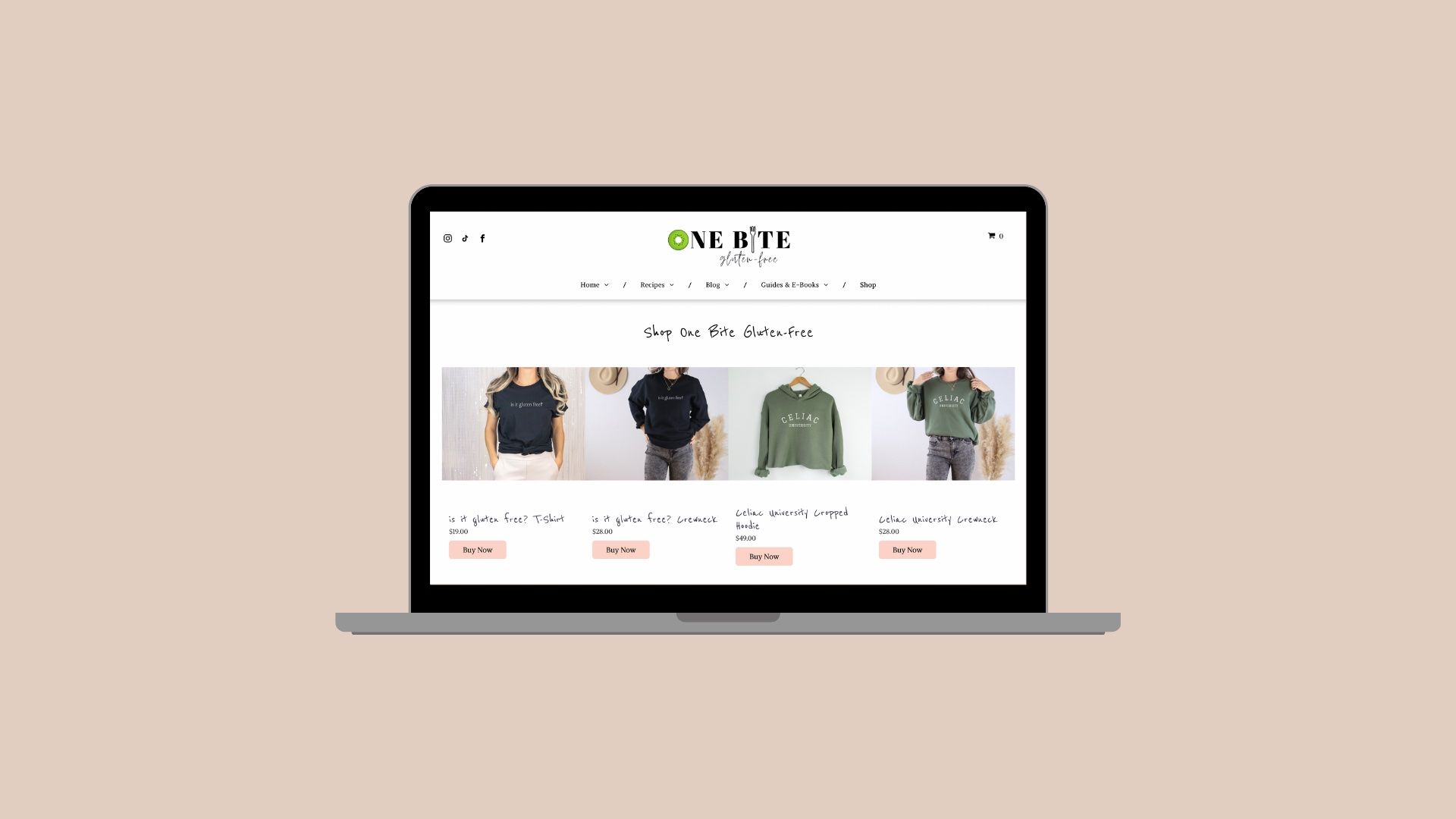 A laptop computer is open to a website with clothes on it.