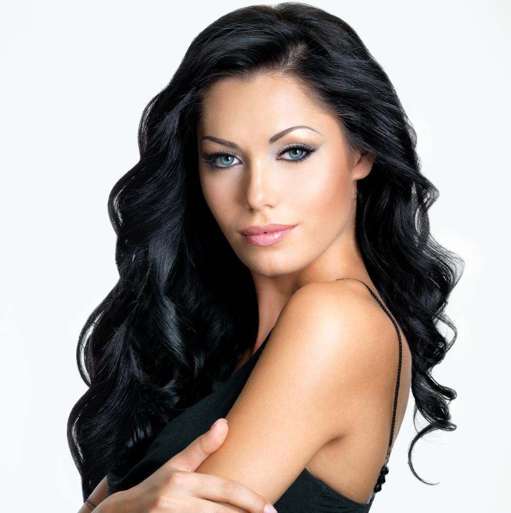 Portrait of A Woman with Long Black Hair in A Black Top — Fraser Shores Hair Design In Urraween, QLD