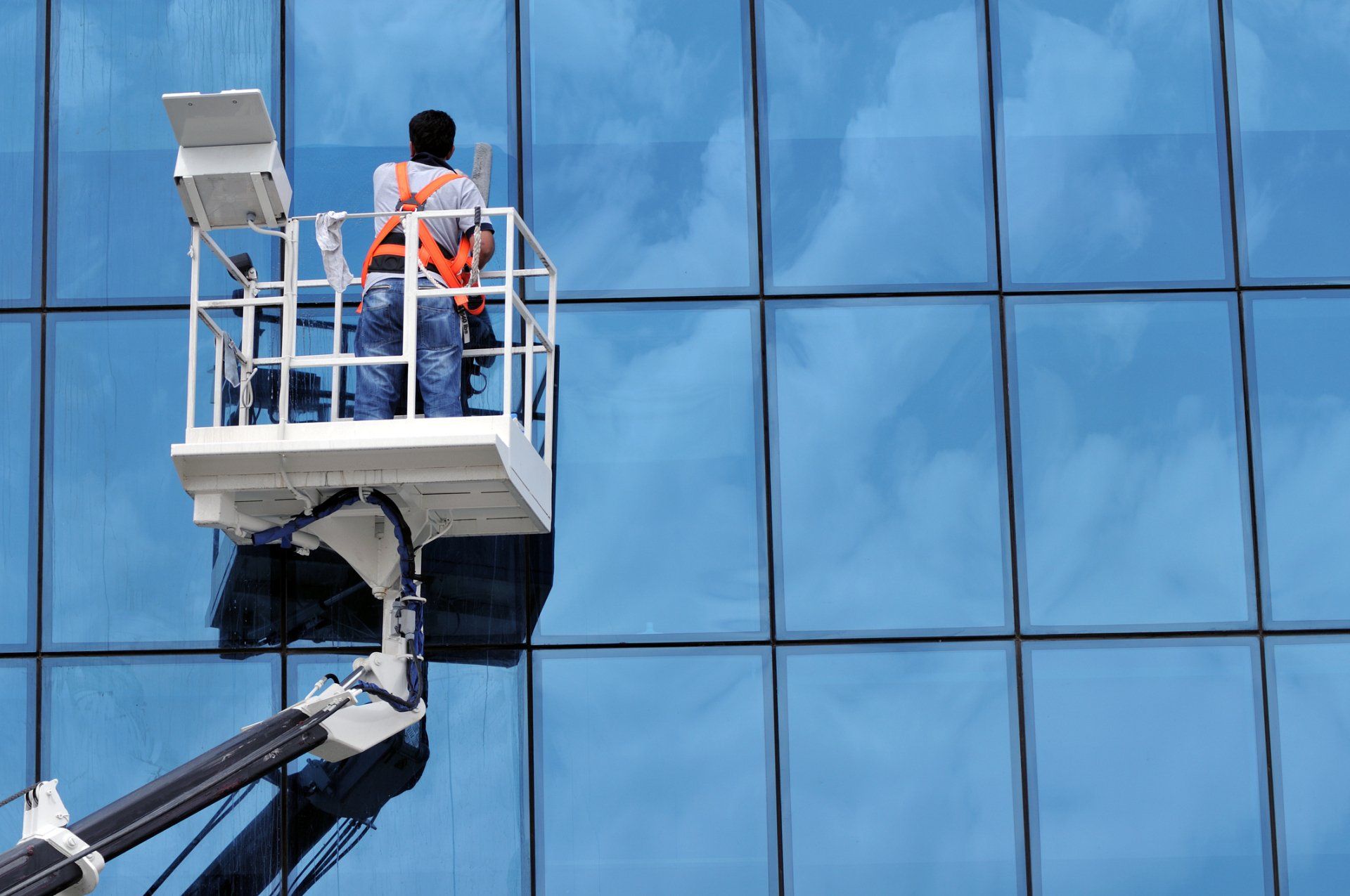 Man Cleaning Glass — Saugus, MA — Arrow Property Services