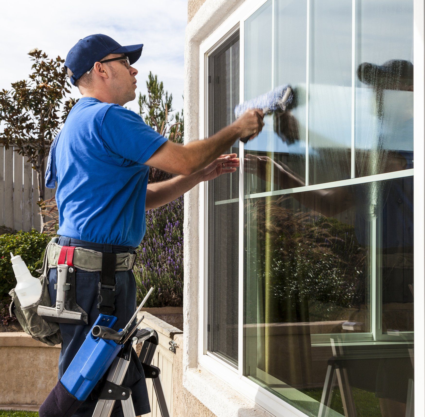 Man Cleaning Glass Window — Saugus, MA — Arrow Property Services