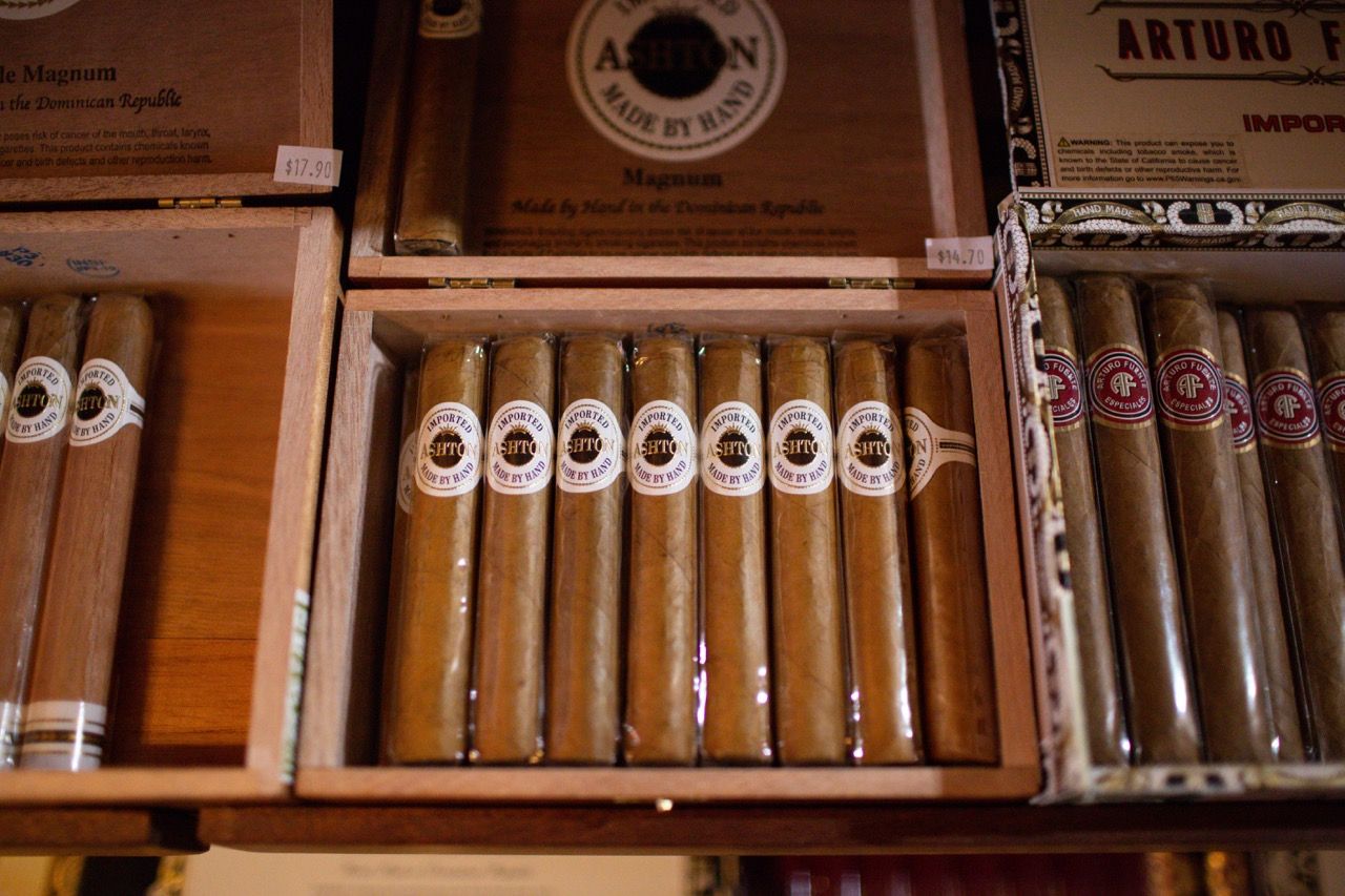 A box of arturo f cigars sits on a shelf
