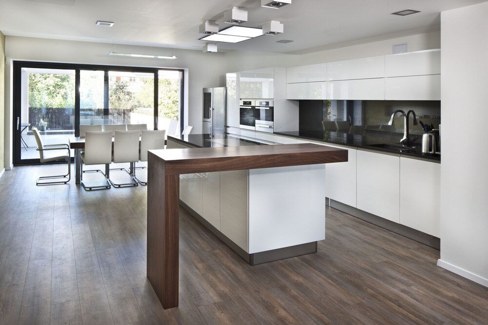 Kitchen with a Bench and Dining Room Table— Nielsen Construction in Wagga Wagga, NSW