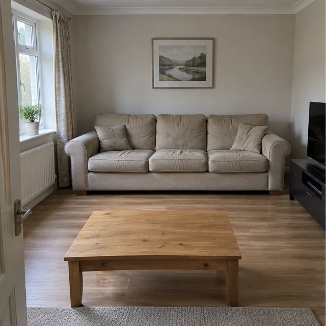 Room with the old sofa still in place, before collection